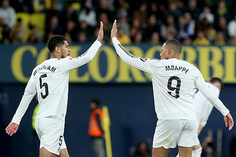 Real Madrid's Kylian Mbappe celebrates with Jude Bellingham, left, after scoring his side's second goal during a Spanish La Liga football match between Villarreal and Real Madrid in Villarreal, Spain.
