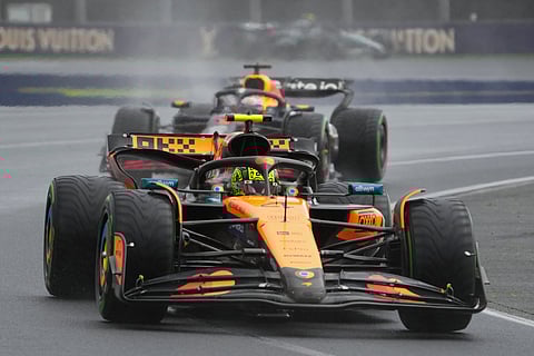 McLaren driver Lando Norris of Britain leads Red Bull driver Max Verstappen of the Netherlands during the Australian Formula One Grand Prix at Albert Park, in Melbourne, Australia..