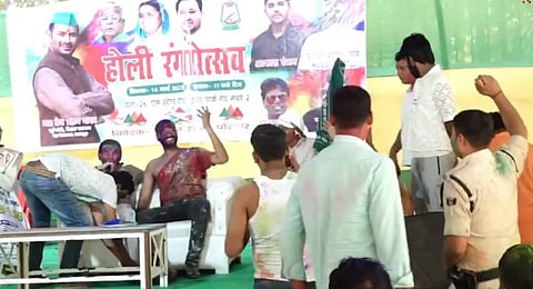 The constable seen hopping a few times with his right arm raised high in the air.