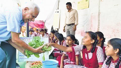 Students from various government schools sell vegetables at model market in Kashmirgadda Rythu Bazaar in Karimnagar on Monday.