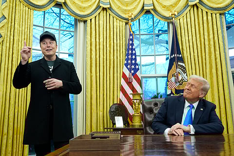 President Donald Trump listens as Elon Musk speaks in the Oval Office at the White House, Tuesday, Feb. 11, 2025, in Washington.