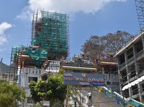 Workers engaged in renovation works at the Maruthamalai Murugan temple in Coimbatore on Sunday.