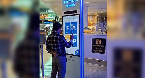 The kiosks are positioned at key locations, including security checkpoints, retail areas, and baggage claim zones.