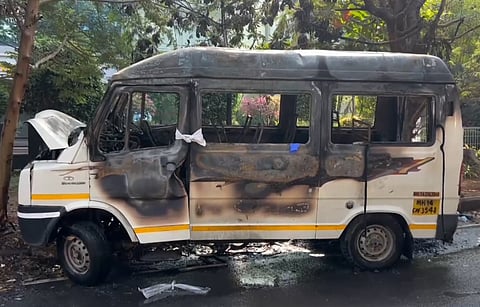 Charred remains of a tempo traveller that caught fire while it was ferrying some employees of a company to their office, at Hinjewadi, near Pune, Wednesday, March 19, 2025.