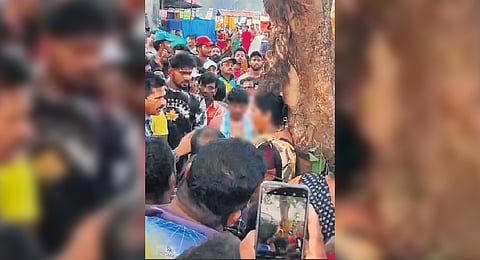 The screengrab showing the woman tied to a tree and being assaulted, in Malpe, Udupi.