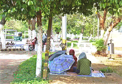 Worker taking rest under the tree on at Wednesday afternoon in Bhubaneswar.