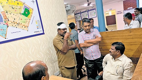 Kadapa RTC Zonal Chairman P Nagaraju with injured APSRTC driver NRS Reddy at the Bengaluru police station on Friday.
