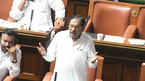 Home Minister Dr G Parameshwara speaks during a debate on the attempted honey trapping of a minister in the Legislative Assembly on Thursday.
