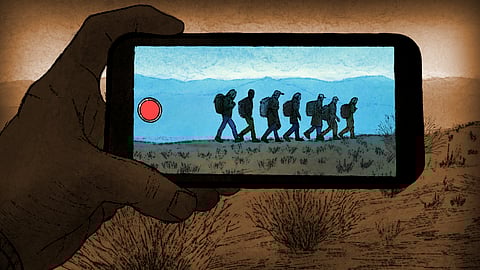 A depiction of a smuggler videoing migrants walking through the Mexican deserts in their attempt to reach the United States.