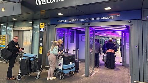 Travellers arrives at Terminal 5 as London's Heathrow Airport says it plans to resume some flights later Friday after a fire at a nearby electrical substation has caused a closure of Europe's busiest airport in London, Friday, March 21, 2025.