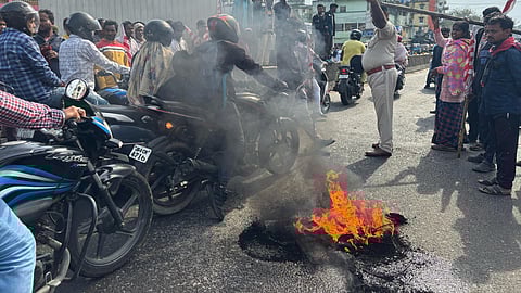 Tribal people block the Ranchi-Jamshedpur road during 'Ranchi bandh' in protest against the construction of a flyover near a Sarna Sthal, a sacred tribal religious site, in Ranchi, Jharkhand, Saturday, March 22, 2025.