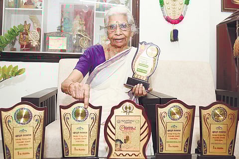 Rajamma with the trophies she won in cultural competitions.
