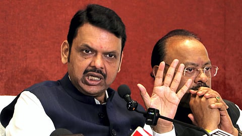 Maharashtra Chief Minister Devendra Fadnavis with Revenue Minister Chandrashekhar Bawankule addresses a press conference regarding recent voilence, in Nagpur, Saturay, March 22, 2025.