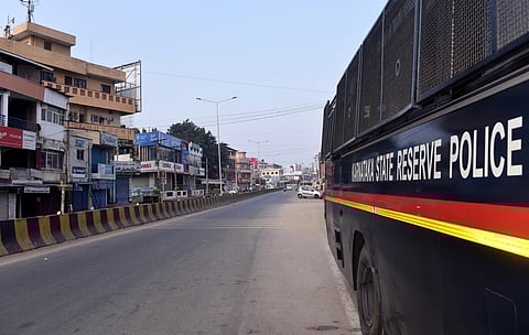 A police vehicle parked at a deserted road during statewide bandh, in Chikkamagaluru, Karnataka, Saturday, March 22, 2025.
