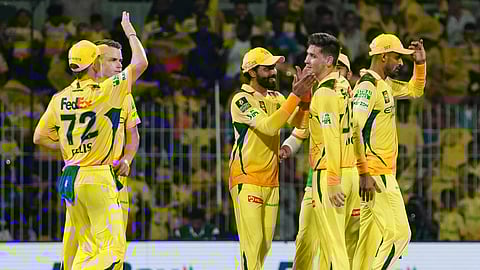 Chennai Super Kings celebrate a wicket against Mumbai Indians