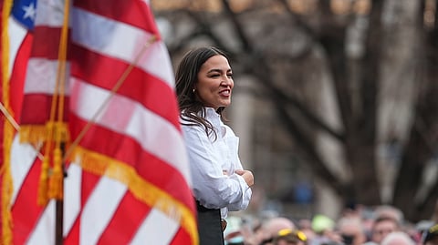 Rep. Alexandria Ocasio-Cortez, D-N.Y., greets well-wishers during a stop of the lawmakers' "Fighting Oligarchy" tour that filled Civic Center Park, Friday, March 21, 2025, in Denver.