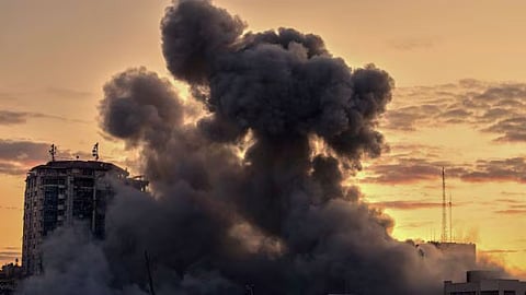 Smoke rises from a building after it was targeted by an Israeli army strike, following evacuation orders for residents, in Gaza City.