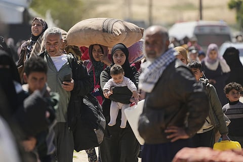 Displaced Palestinians, who flee from Rafah amidst ongoing Israeli military operations following Israel's renewed offensive in the Gaza Strip, arrive in Khan Younis, Gaza on Sunday, March 23, 2025.