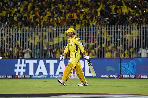 MS Dhoni walks in to bat