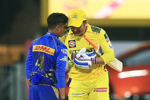 Chennai Super Kings' Mahendra Singh Dhoni, right, talks to Mumbai Indians' young debutant Vignesh Puthur after Chennai Super Kings won the Indian Premier League cricket match against Mumbai Indians in Chennai, Sunday, March 23, 2025.