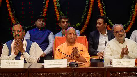Uttar Pradesh Chief Minister Yogi Adityanath with Dy CM Keshav Prasad Maurya and BJP state President Bhupendra Singh Chaudhary during a press conference