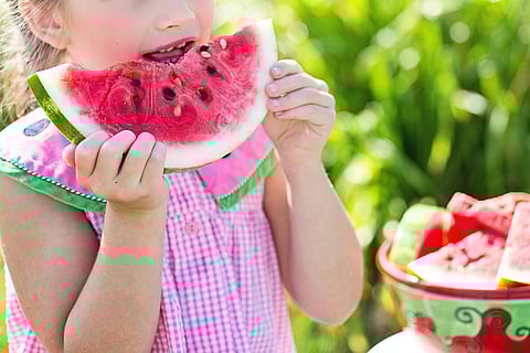 Representative picture of girl eating a watermelon. People with misophonia often can't stand chewing sounds