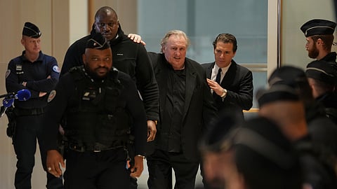 Actor Gerard Depardieu, center, leaves with his lawyer Jeremie Assous, right, to the courtroom for a break during his trial for the alleged sexual assaults of two women on a film set in 2021, Tuesday, March 25, 2025 in Paris.