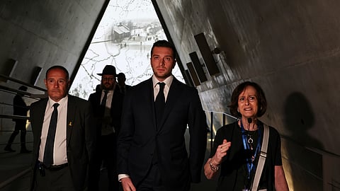 Leader of France's National Rally (RN) Jordan Bardella, center, and RN member and EU lawmaker Fabrice Leggeri, left, visit the Yad Vashem Holocaust Memorial in Jerusalem, Israel, Wednesday, March 26, 2025.