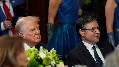 President Donald Trump and House Speaker Mike Johnson of La., listen at the annual St. Patrick's Day luncheon at the Capitol in Washington, Wednesday, March 12, 2025
