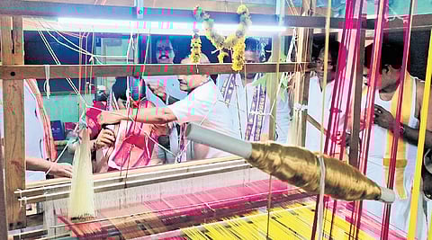 Khammam - In view of lord Rama and Sitadevi kalyanam, weaver SS Jaya Raju is weaving pochampalli pattu vastralu in temple premises in Bhadrachalam. He set up weaving machine and making them.