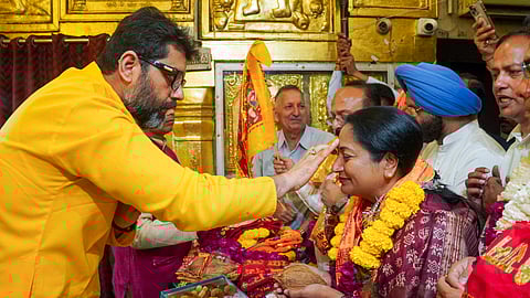 Delhi CM Rekha Gupta visits the Hanuman temple at Connaught Place ahead of the presentation of the Delhi Budget in the Assembly, in New Delhi, Tuesday, March 25, 2025