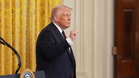 President Donald Trump gestures as he departs a reception celebrating Greek Independence Day in the East Room of the White House, Monday, March 24, 2025, in Washington.