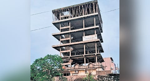 The building prior to the collapse; (right) officials carry out rescue operations in Bhadrachalam on Wednesday
