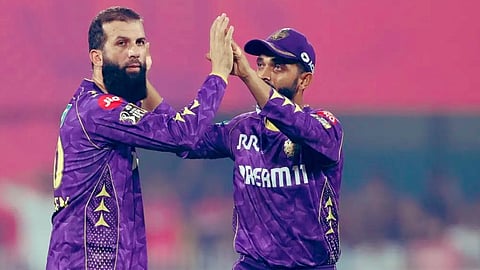 Kolkata Knigh Riders' spinner Moeen Ali celebrated with captain Ajinkya Rahane after a wicket in their IPL match against Rajasthan Royals in Guwahati.