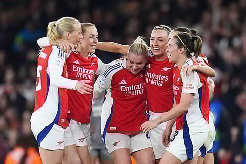 Arsenal's Alessia Russo, centre, and team-mates celebrate following the Women's Champions League, quarter-final, second leg soccer match between Arsenal and Real Madrid in London, Wednesday March 26, 2025.
