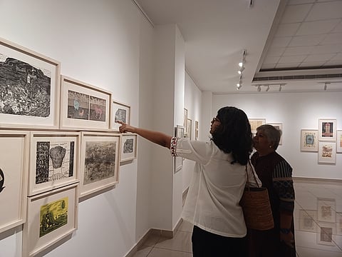 Visitors soak in the art experience at the exhibition