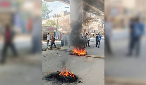 BJP supporters burn tyres to block a road during the 'Ranchi Bandh' called by Jharkhand BJP and All Jharkhand Students Union (AJSU) against the murder of BJP leader and former Zila Parishad member Anil Mahto