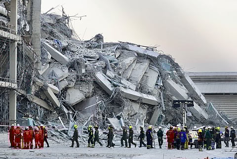 Rescuers work at the site of a high-rise building under construction that collapsed after a 7.7 magnitude earthquake in Bangkok, Thailand, Friday, March 28, 2025.