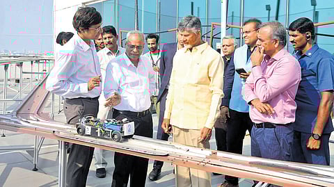 Chief Minister Nara Chandrababu Naidu examines a technology project at All India Research Scholars Summit-2025 in IIT Madras on Friday