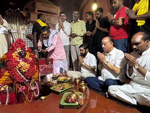 Kanhaiya Kumar, seated extreme left, offering worship at the temple