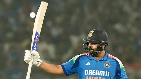 Indian batter Rohit Sharma celebrates his century during the 2nd ODI match against England at the Barabati Stadium in Cuttack, Odisha.