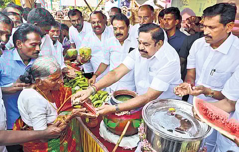 AIADMK general secretary Edappadi K Palaniswami distributing buttermilk to people in Salem on Saturday