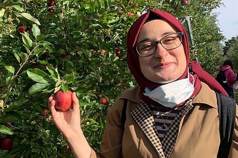This contributed photo shows Rumeysa Ozturk on an apple-picking trip in 2021.