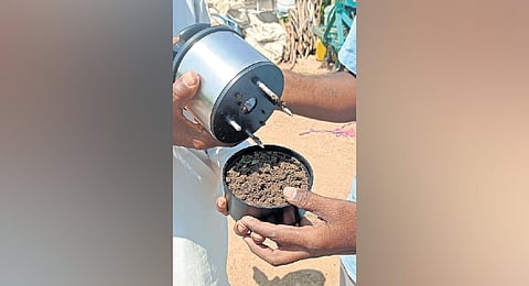 A farmer receives a demonstration of the Soil Spectra in Nirmal district