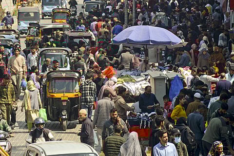 People shop for the Eid-ul-Fitr festival, near Ghanta Ghar in Srinagar, Sunday, March 30, 2025.