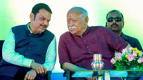 Maharashtra Chief Minister Devendra Fadnavis, left, and RSS chief Mohan Bhagwat during a book release event on Vedic Mathematics ,organised by Bharti Krishna Vidya Vihar, in Nagpur, Maharashtra, Monday, March 31, 2025.