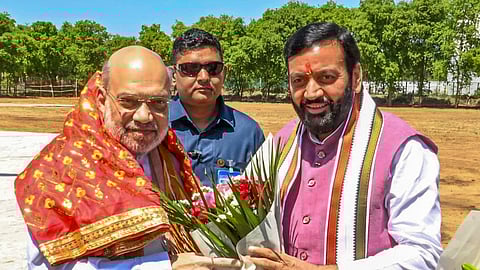 Union Home Minister Amit Shah being welcomed by Haryana Chief Minister Nayab Singh Saini upon his arrival, in Hisar on March 31, 2025.