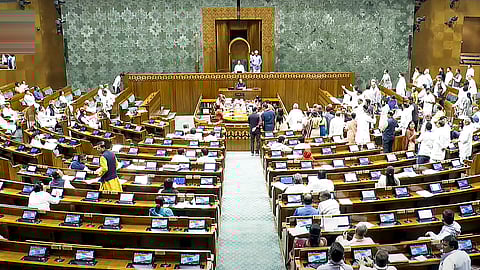 Opposition MPs protest in the Lok Sabha during the Budget session of Parliament, in New Delhi, Tuesday, April 1, 2025.