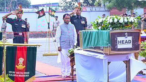 Chief minister Mohan Charan Majhi paying floral tributes to martyred Odia soldier at the Bhubaneswar airport.