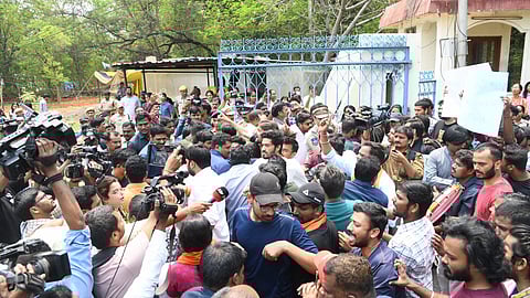 Protests against the Telangana government demanding the removal of police personnel and earth-moving machinery from the campus.